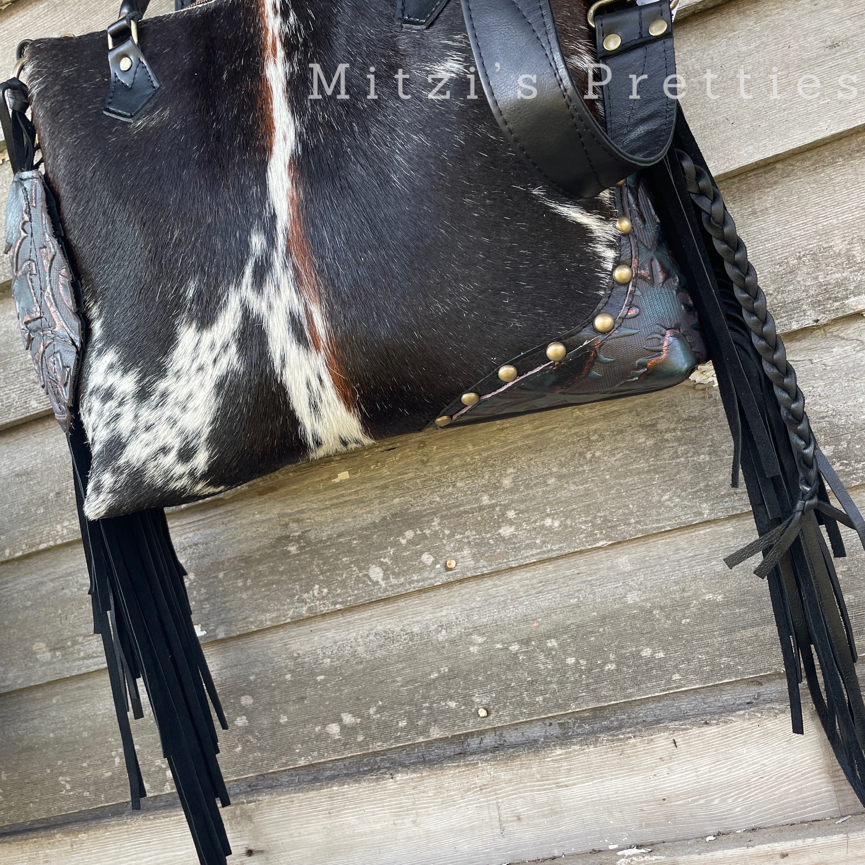 Fringe-Adorned Cowhide Bag with Crossbody Strap and Tote Handle