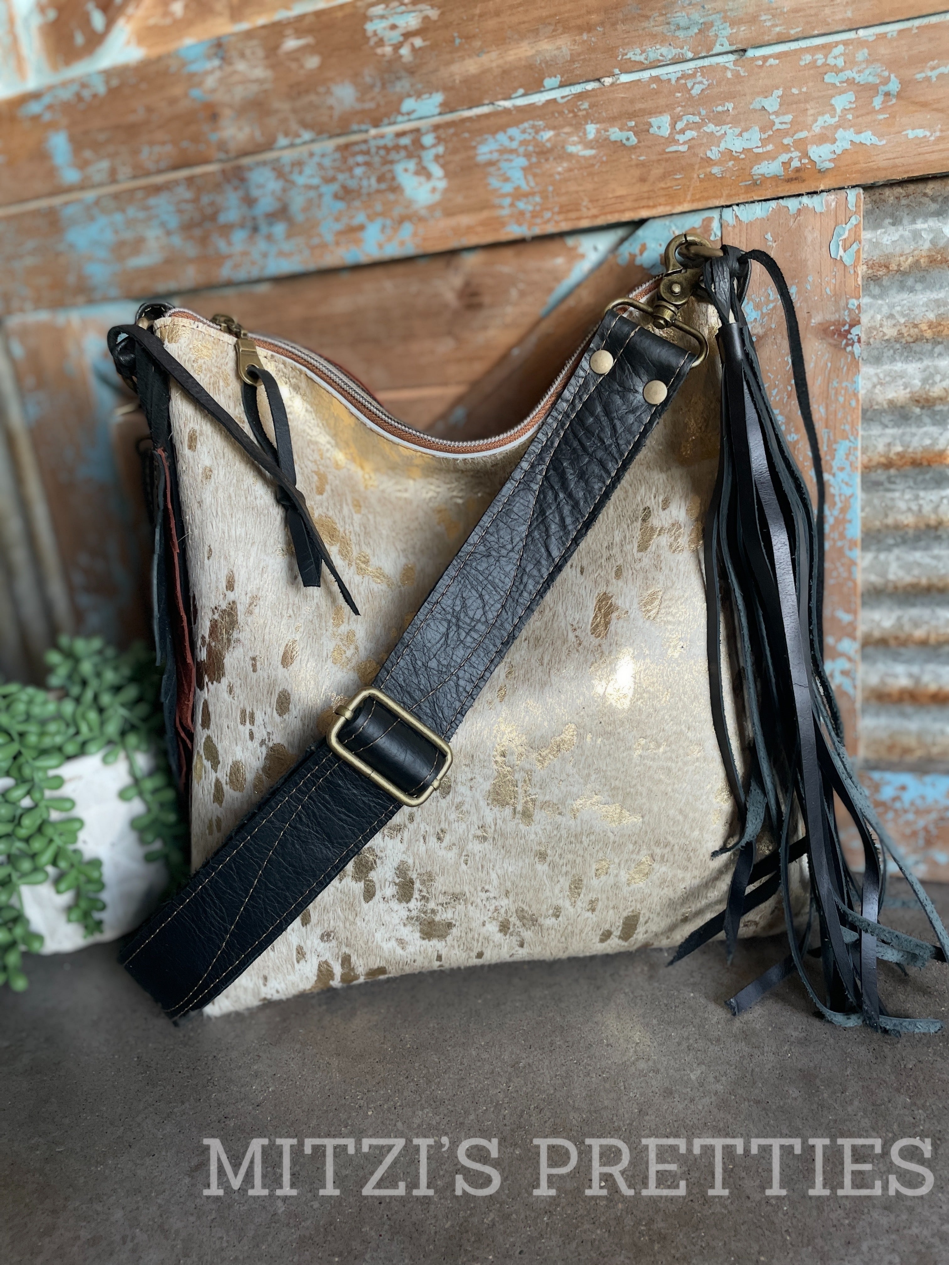 Cowhide bags hotsell and purses