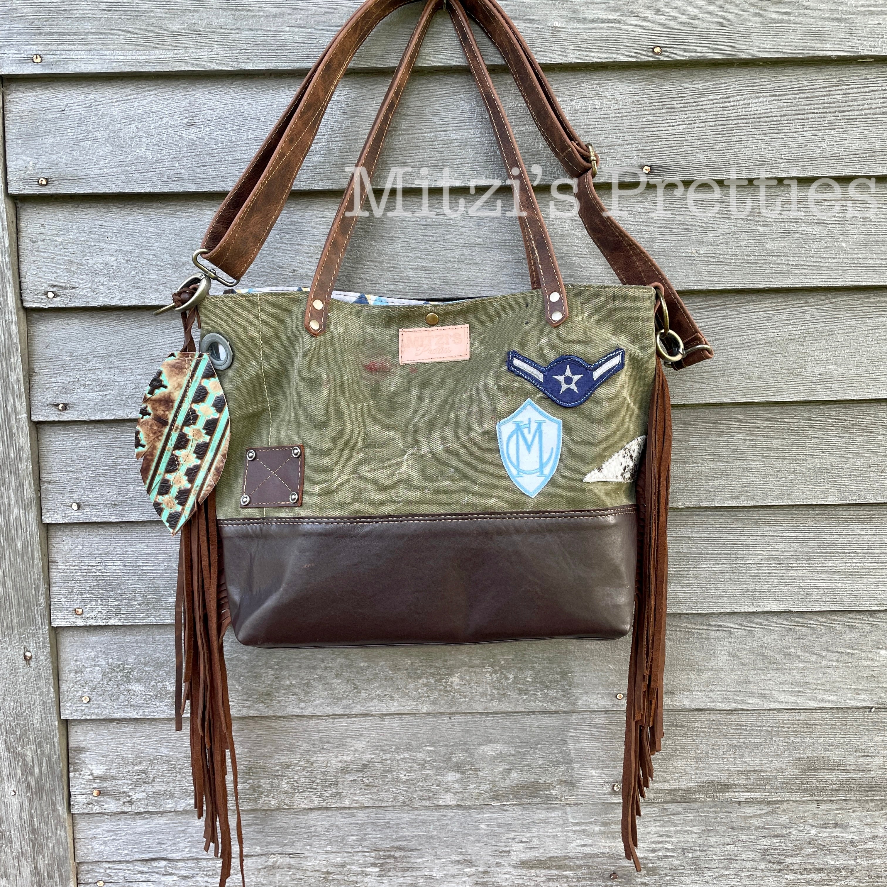 Fringe-Adorned Cowhide Bag with Crossbody Strap and Tote Handle